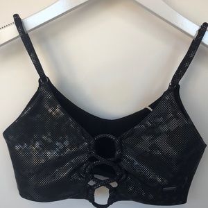 Maaji 2-way style sports top in black with metallic diamond pattern.